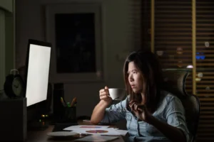 A woman working late.